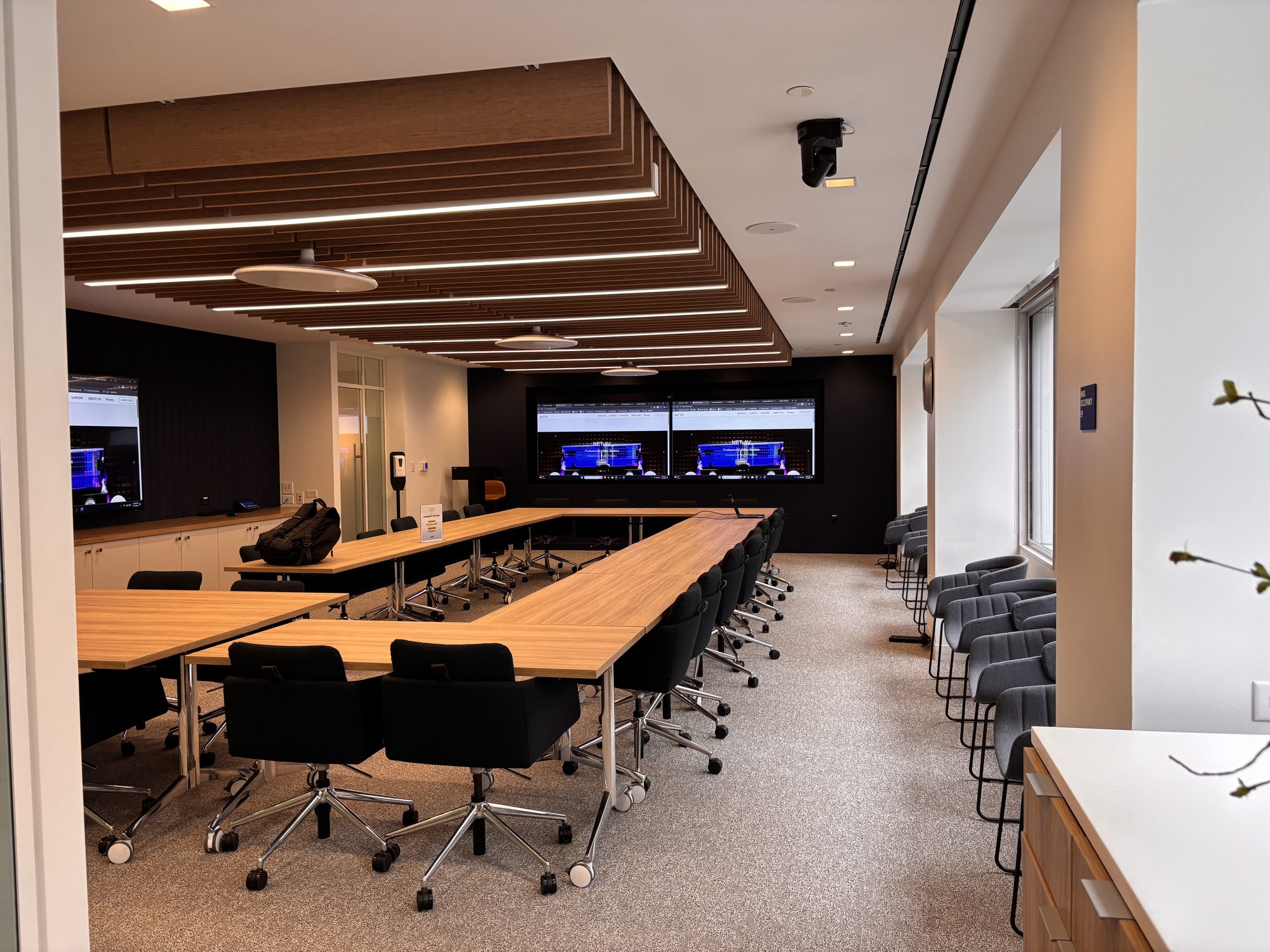 Executive boardroom with dual displays
